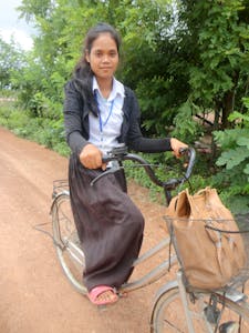 After Kim Sath's father died several years ago, she spent most of her time working on the family farm. Thanks to FH training, she now has a normal childhood going to school and playing with friends.