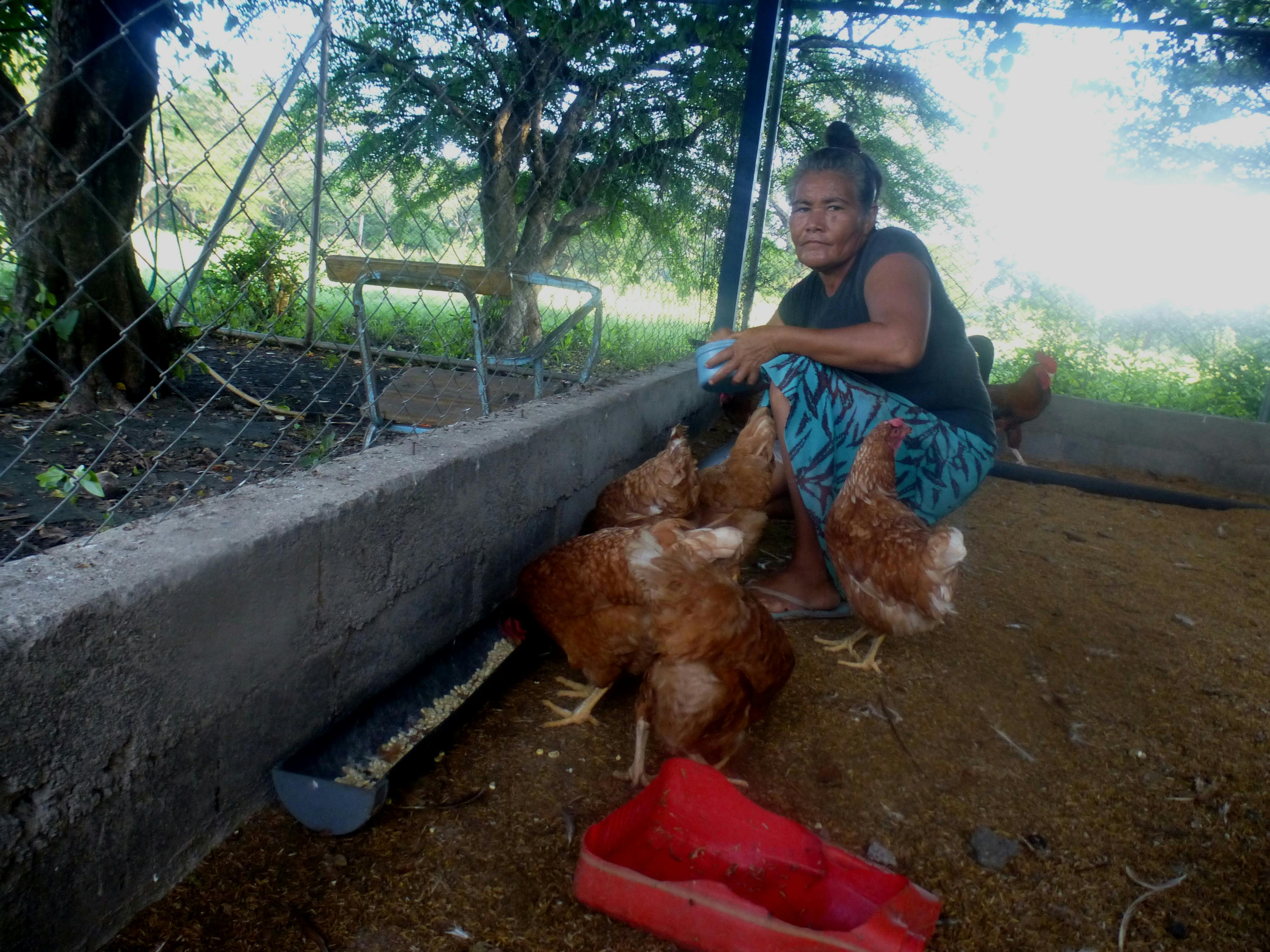Lonsa Mejía with her chickens in El Porvenir, Nicaragua.