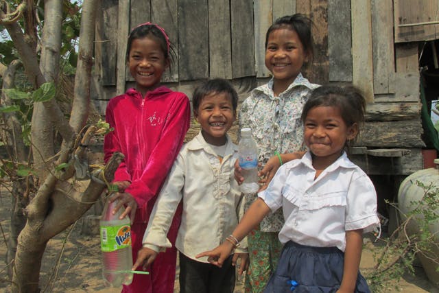 Children and their tippy tap in Cambodia