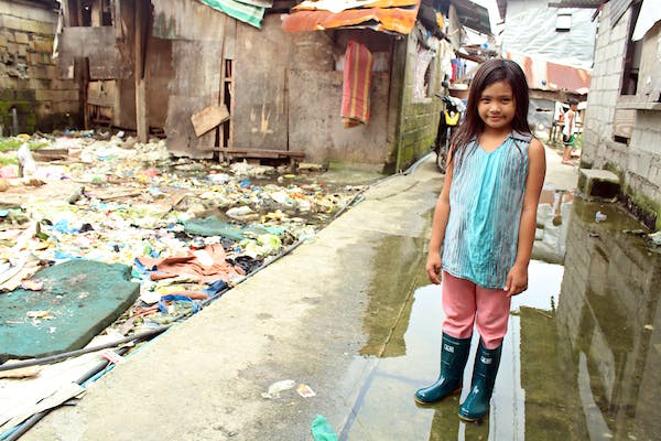 Althea, an 8-year-old girl in the Philippines whose community struggles with the problem of flooding, but has benefited from FH's rubber boots distribution that prevents the spread of diseases. 