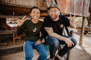 FH Creative Director and child sponsor Doug Penick and Sopheap, sponsored child, pose for a photo in Cambodia.