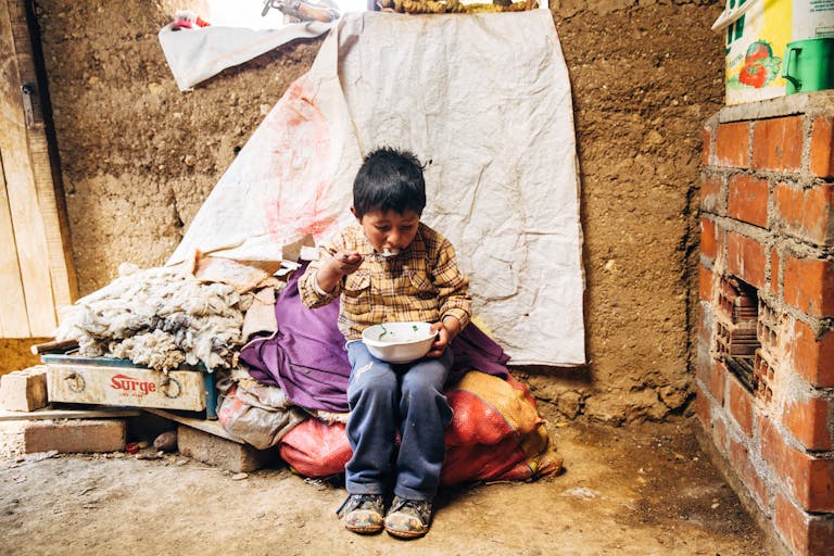 Boy in Peru eating
