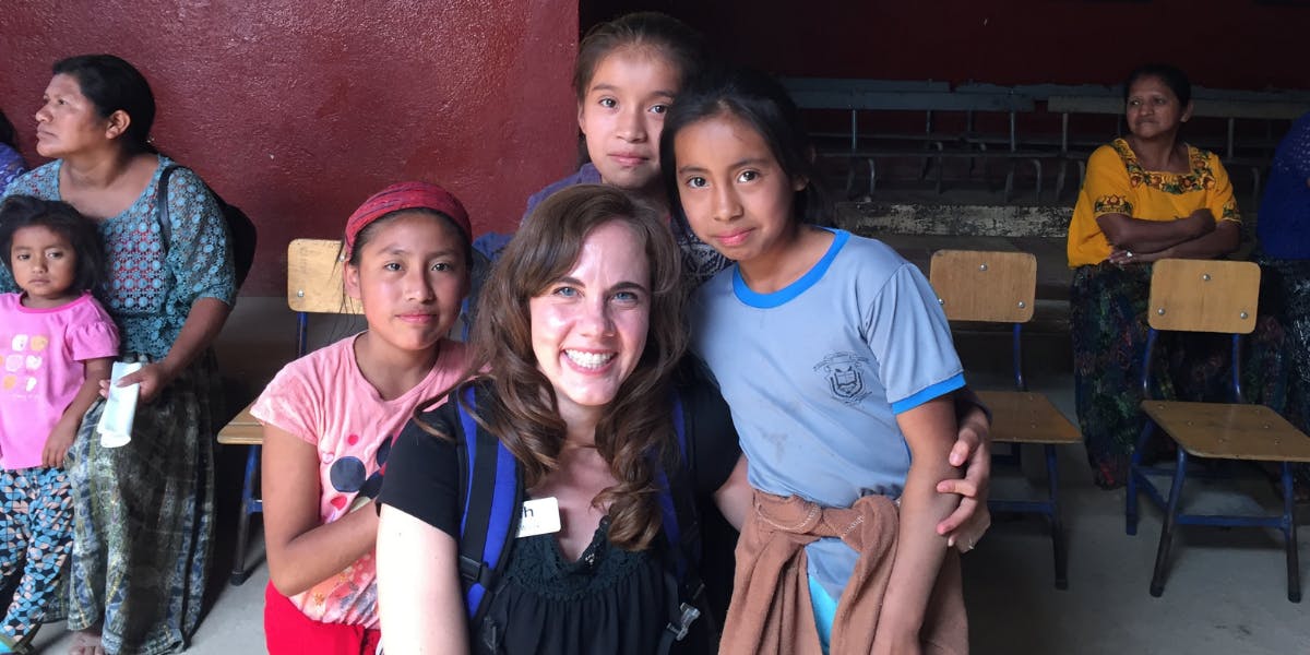 Beth poses with Guatemalan children