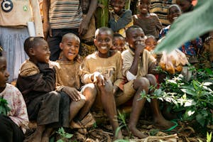Children smiling in Burundi FH community