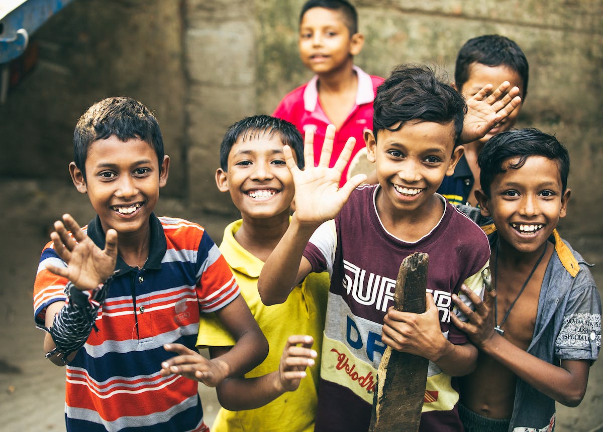 Sponsored children in Bangladesh smile for a photo