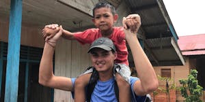 Julie's son, Dylan Hale, meets their sponsored child in Mentawi, Indonesia.