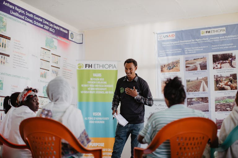 Sintayehu participates in an FH savings group meeting.