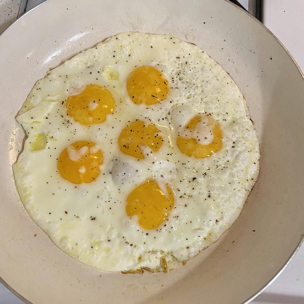 eggs cooking in a pan