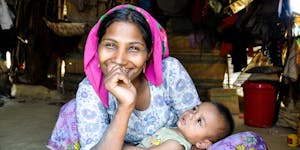 A mother holding her small baby in Bangladesh country.