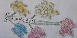 drawing of a flower and text that reads love you