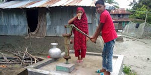 Children in Bangladesh using Tube Well to get clean water.