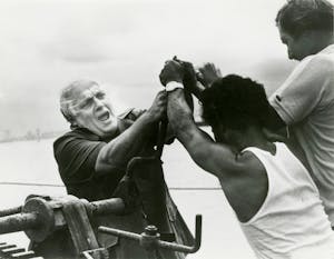 Larry Ward with Vietnamese boat people