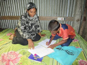 Mustakin and mother studying together