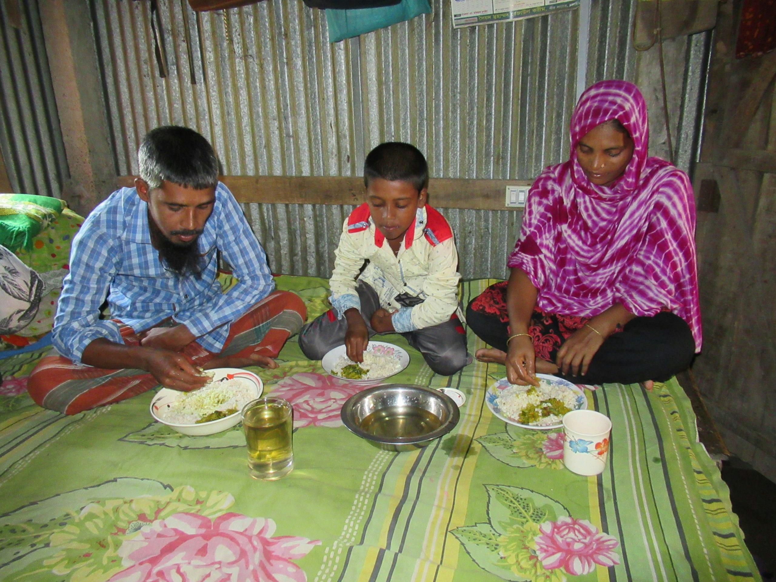 Mustakin and family eating dinner together