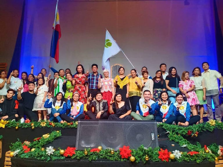 Group shot of FH Philippines staff on a stage