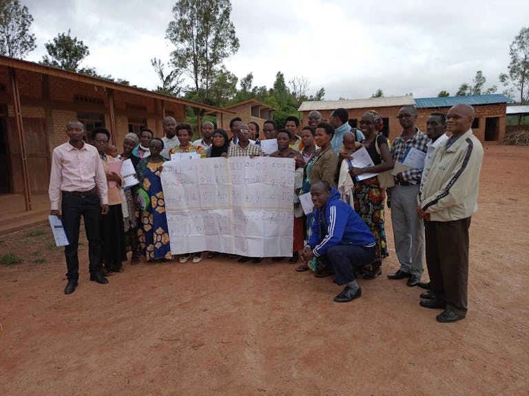 teachers in a group showing reading training materials