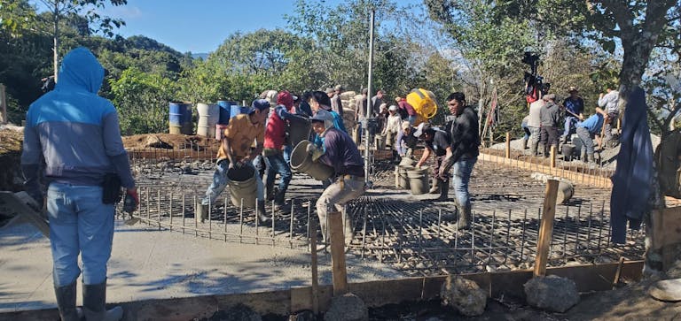 Men pouring cement slab