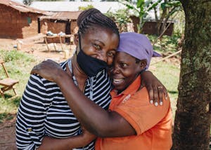 two Ugandan women embracing