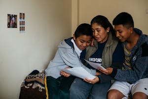 Mother in Peru Hugs Children