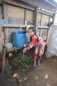 A gift of chickens and training in hygiene benefitted the entire family – including Parb's 7-year-old granddaughter