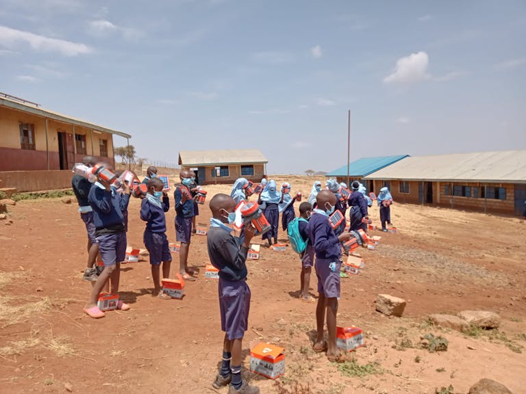 Students in Kenya receive solar lighting packs