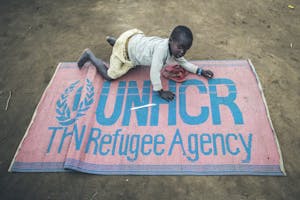 Child with UNHCR Blanket
