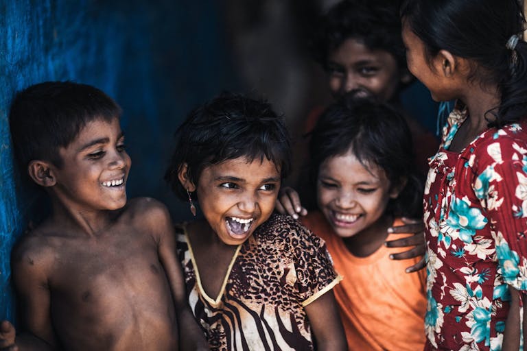 Rohingya refugee children smiling for a picture