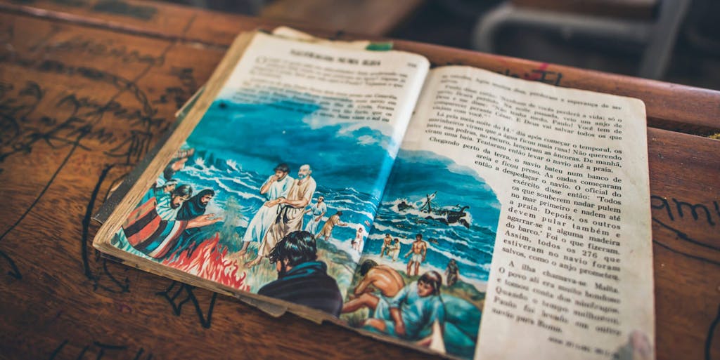 Children's illustrated bible lies open on a desk, found during relief efforts in post-cyclone Mozambique