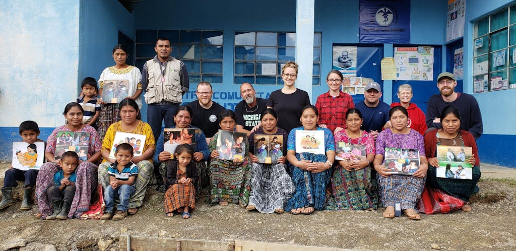 origins church team members alongside members of the community in Guatemala