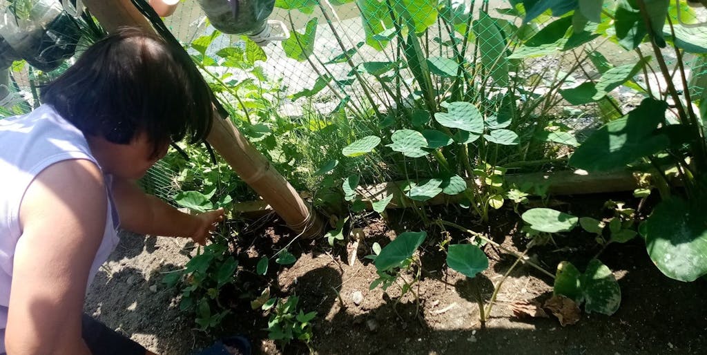 woman bending over to work in garden