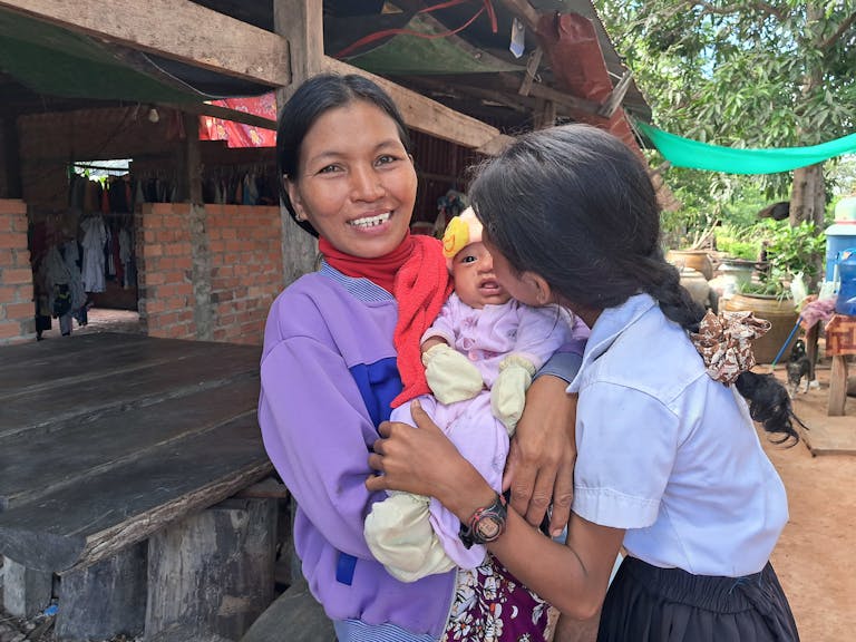 Sievminh with her mother and baby sister.