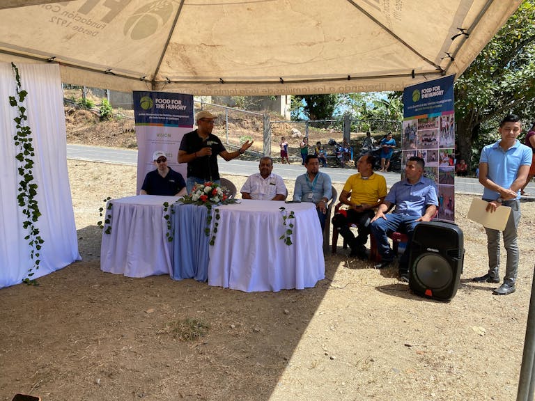 Country director of FH Nicaragua speaking at a community event.