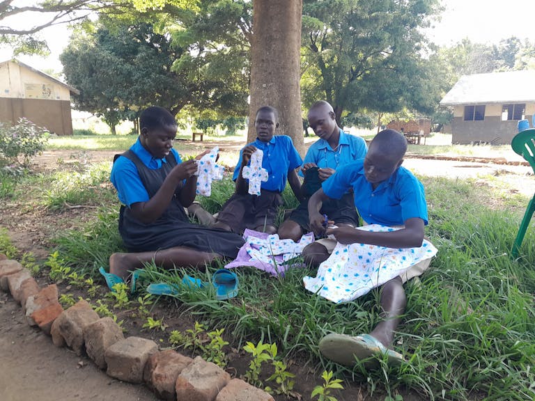 Anena creating reusable sanitary pads with her peers.