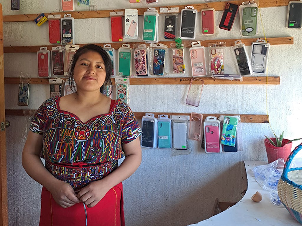 Rosa-with-her-cellphone-accessories-business-wide